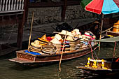 Thailand, Locals sell fruits, food and products at Damnoen Saduak floating market near Bangkok 